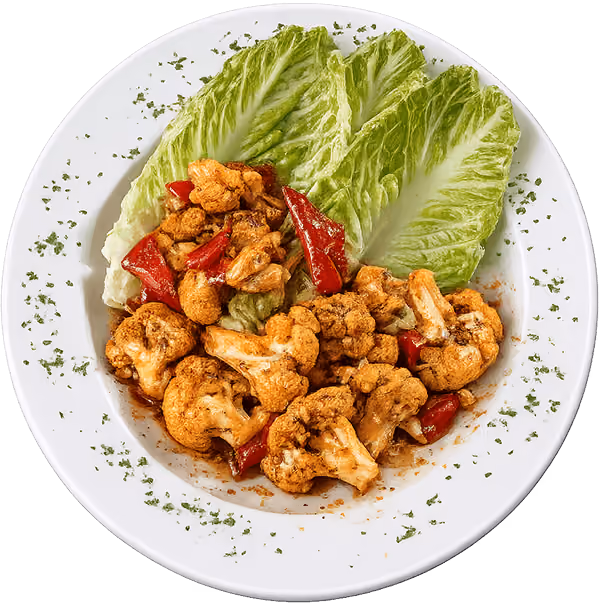Cajun roasted cauliflower with roasted red peppers and crisp romaine lettuce.