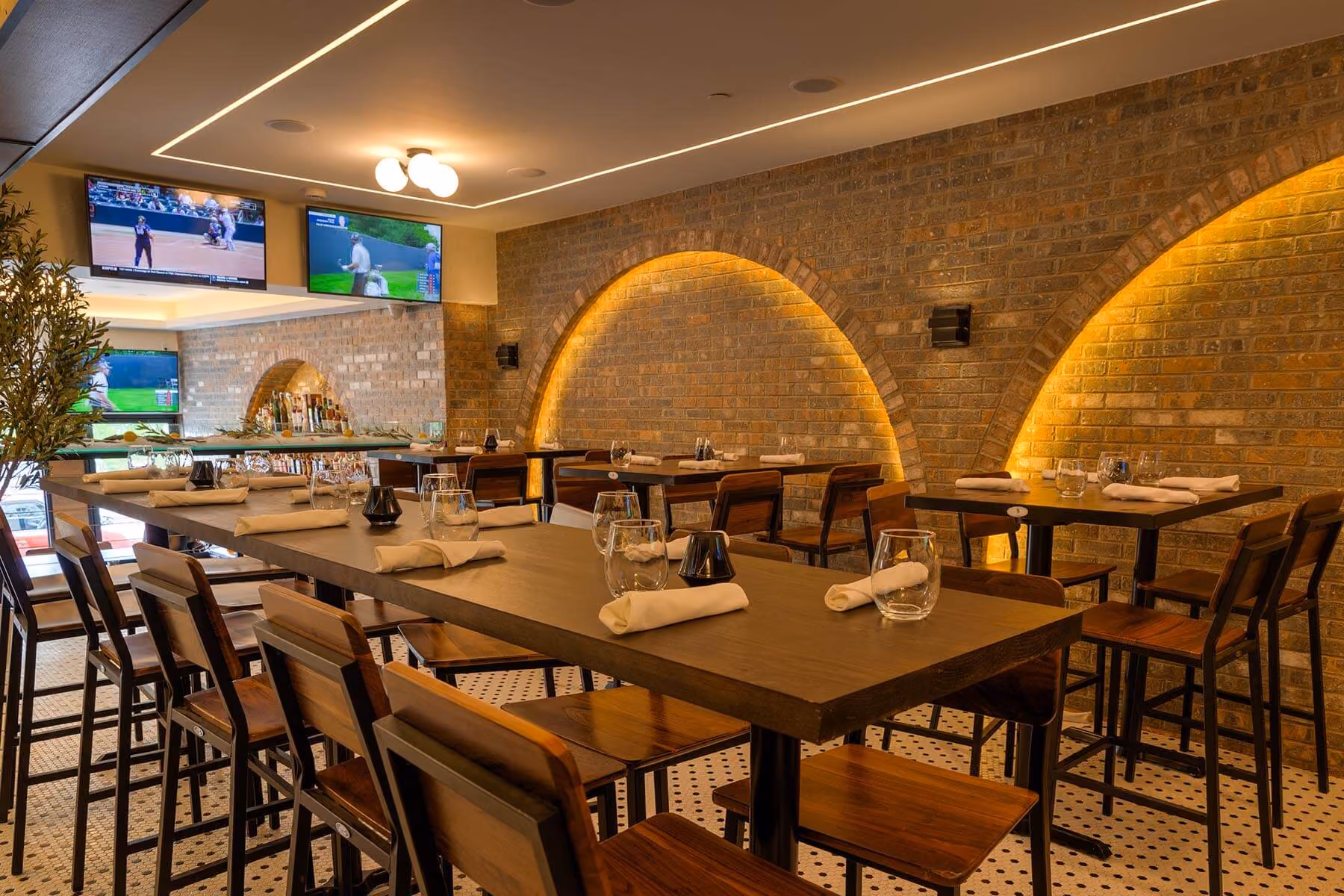 Second-floor dining room with TVs
