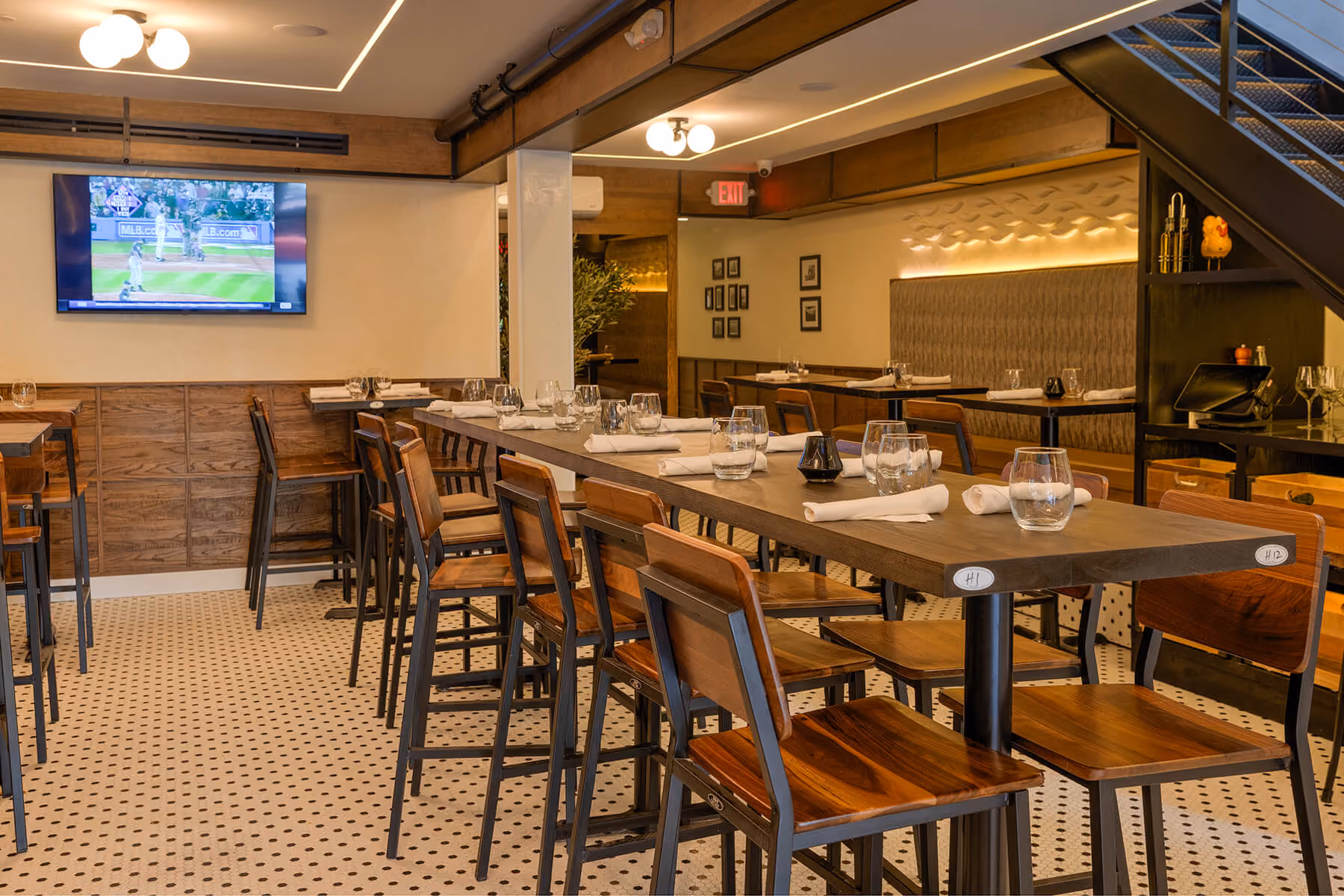 Second-floor dining room with TVs