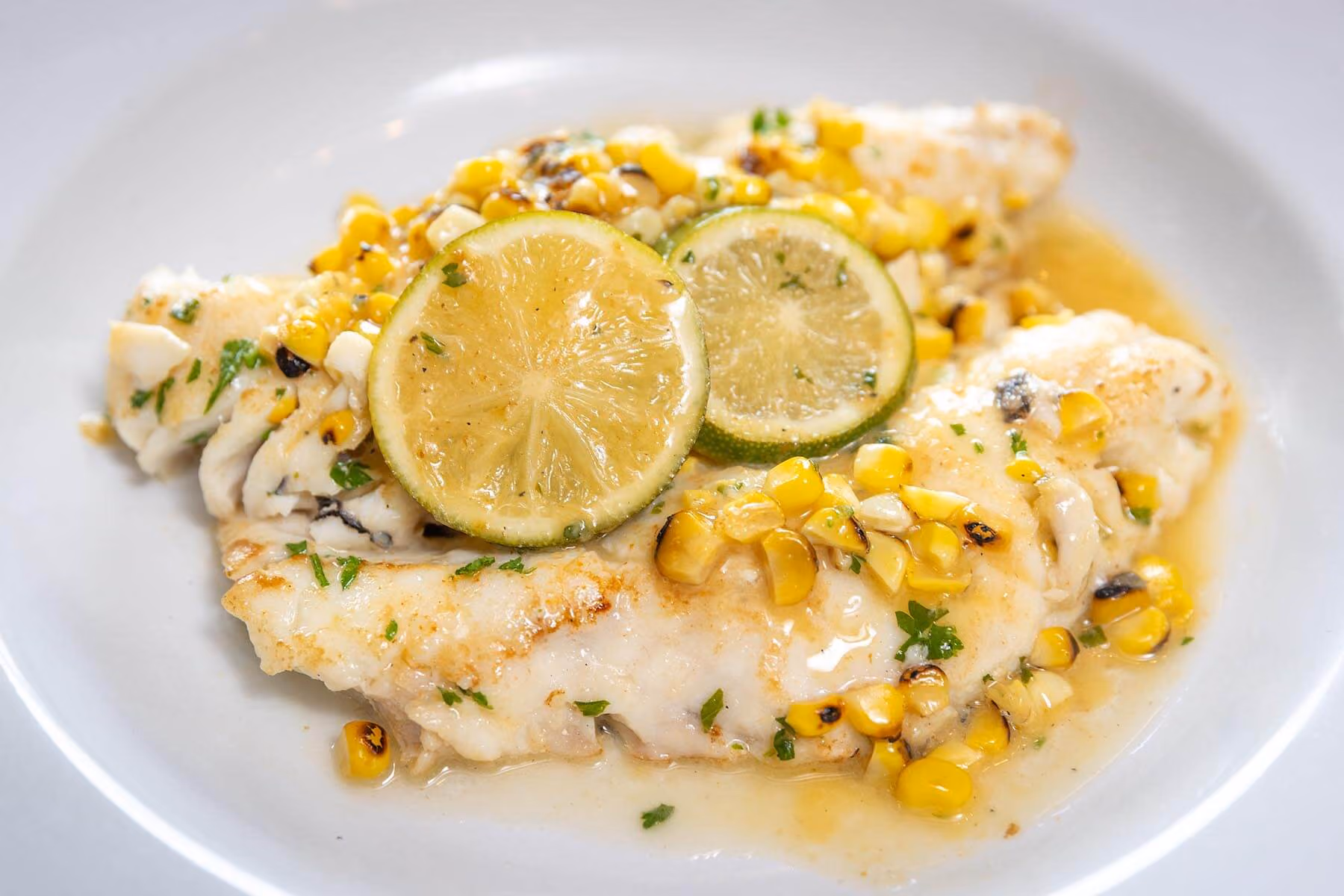 Pan-seared Chilean sea bass with corn succotash